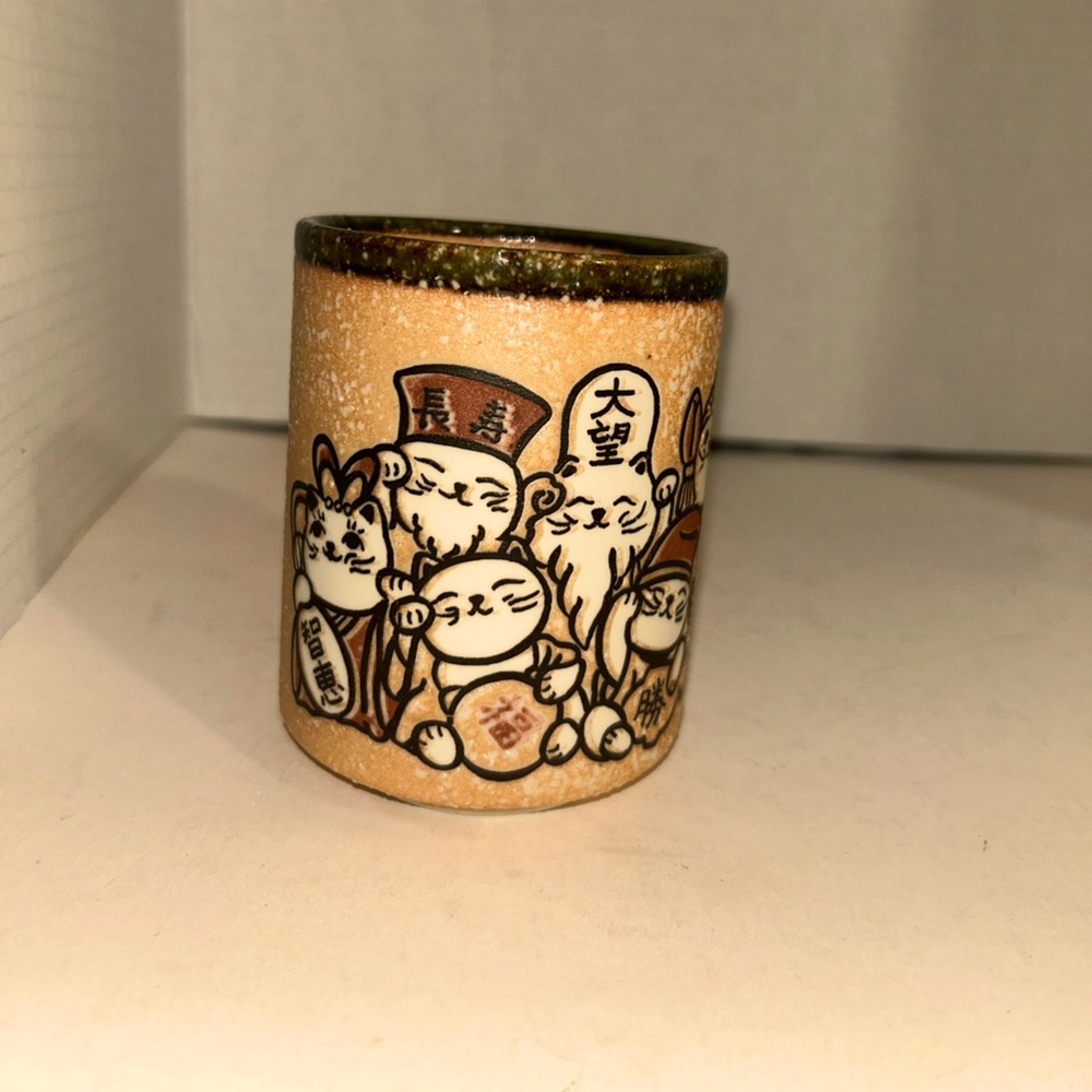 Mino ware tea cup with seven Catty Gods. Japanesee